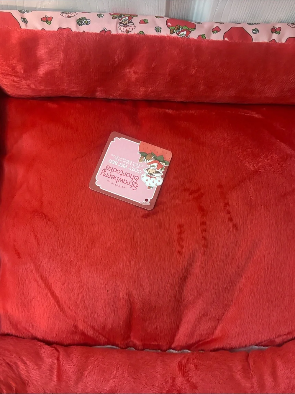Plush Red Small Pet Bed with Strawberry-Patterned Border